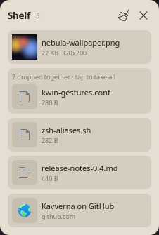 The shelf, holding files, a pile and a link